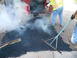 Recycled Asphalt being raked