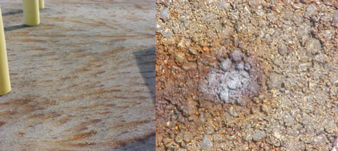 Rust on Asphalt Surface